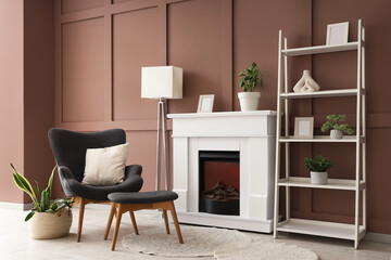 Interior of stylish living room with lamp, fireplace and armchair