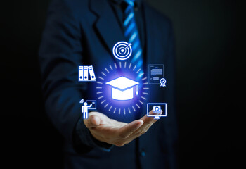 Businessman presenting digital graduation cap icon with education technology, online learning, e-learning platform, training courses, and virtual study for modern knowledge innovation.