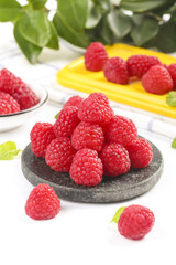 Fresh Red Raspberries on Stone Plate with Shallow Depth of Field