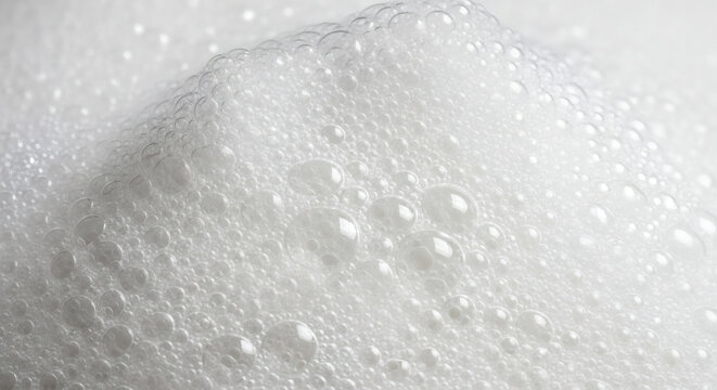 A close up view of a mass of white bubbles with varying sizes and shapes creating a dense texture