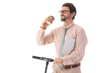 Handsome businessman with coffee and laptop riding electric scooter on white background