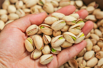 Handful of Roasted Pistachios with Green Kernels - Healthy Nuts Snack Food