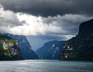 Dramatic fjord landscape under a stormy sky