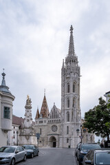 Fototapeta premium Budapest, Hungary – View of the Castle District with Matthias Church in the background. A historic area atop Buda’s hills, known for its medieval streets, royal heritage, and iconic skyline.