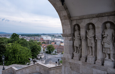 Obraz premium Budapest, Hungary – View of Árpád-era warrior statues in wall niches at Fisherman’s Bastion, Castle District—evoking Hungary’s founding tribes and medieval legacy.