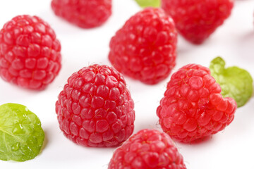 Fresh Red Raspberries with Green Leaves on White Background - Organic Berry Fruit Food Photography