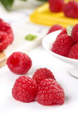 Fresh Red Raspberries on White Background with Colorful Fruits