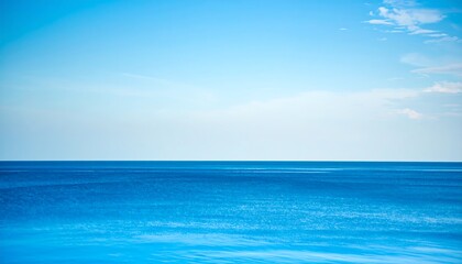 Obraz premium Serene Ocean Horizon with Azure Sky and Calm Waters for Background Usage