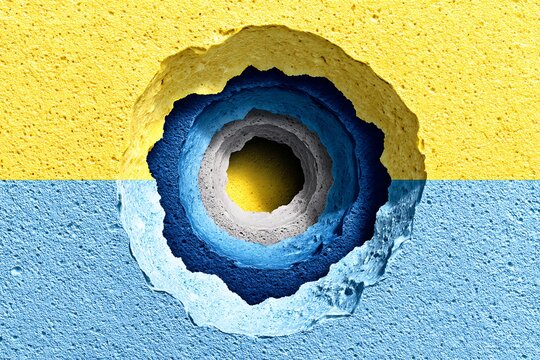 Torn ripped yellow paper hole on blue background - Powered by Adobe