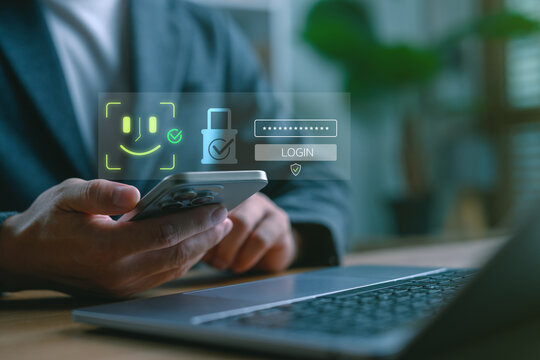 Biometric face recognition and mobile login concept. User holding smartphone with digital security icons. Secure authentication, password protection and digital identity access. - Powered by Adobe