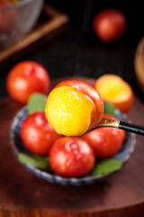 Fresh Cut Plum with Yellow Flesh on Spoon - Stone Fruit Collection