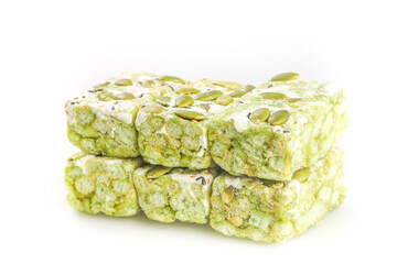 Green Pistachio Nougat Candy Bars with Nuts on White Background - Traditional Middle Eastern Sweet Confection