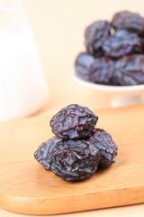 Dried Umeboshi Plums on Wooden Board - Traditional Japanese Pickled Fruit