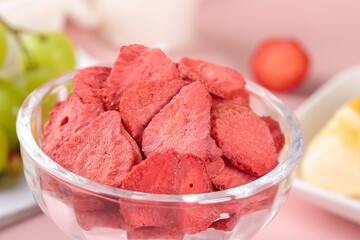 Freeze-Dried Strawberry Pieces in Glass Bowl - Healthy Snack Food Concept