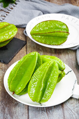 Fresh Green Star Fruit Pentagrams on Marble Plates - Sweet Tropical Fujian Peach Poppy Carambola Slices
