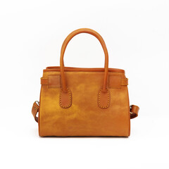 Beautiful tan colored feminine leather bag isolated on white background. Perfect for leather product catalog design.