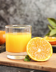 Fresh Orange Juice with Sliced Citrus Fruit on Wooden Board - Healthy Breakfast Drink