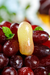 Fresh Red Grapes with Golden Finger Grape and Mint Leaves Close-up