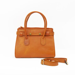 Beautiful tan colored feminine leather bag isolated on white background. Perfect for leather product catalog design.