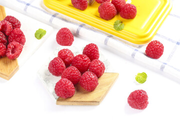 Fresh Red Raspberries on Wooden Boards with Mint Leaves - Healthy Organic Berries