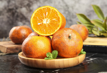 Fresh Organic Oranges on Wooden Plate with Mint - Healthy Citrus Fruit Display