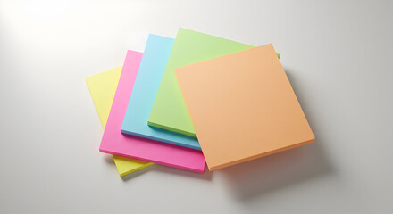 Colorful Stacked Sticky Notes on a White Surface