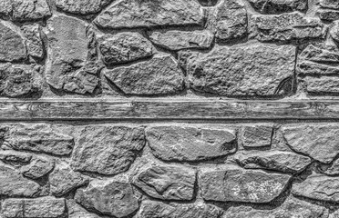Stone wall background in black and white close up view