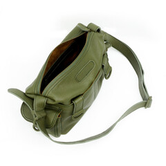 Detail of a green leather sling bag isolated on a white background, an elegant design for active women. Perfect for leather product catalog design.