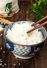 Asian Rice Bowl with Chopsticks on Wooden Table - Traditional Oriental Food Photography