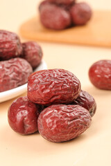 Dried Red Jujube Dates from Ruoqiang Xinjiang China on Wooden Background