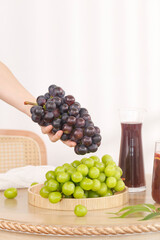 Fresh Purple and Green Grapes with Natural Grape Juice Pitcher for Summer Drinks and Healthy Beverages