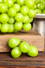 Fresh Green Grapes on Rustic Wood Table with Natural Lighting