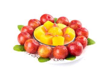 Fresh Red Plums from Guangdong with Yellow Sliced Fruit and Mint Leaves on White Background