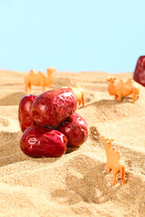 Xinjiang Red Dried Dates with Toy Camels on Sandy Desert Surface - Natural Food Photography