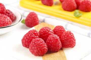 Fresh Red Raspberries on Wooden Cutting Board with Shallow Depth of Field Kitchen Display