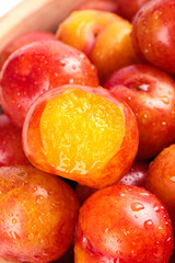 Fresh Red Plums with Water Droplets - Guangdong Stone Fruits Background