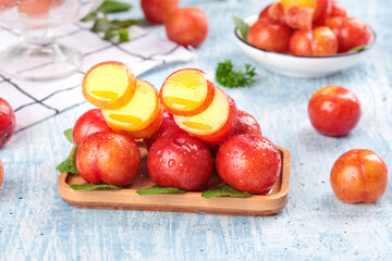 Fresh Red Plums on Wooden Tray - Crisp Stone Fruits Display