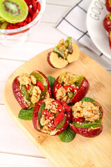 Xinjiang Style Stuffed Red Peppers with Dried Dates and Walnuts on Wooden Board