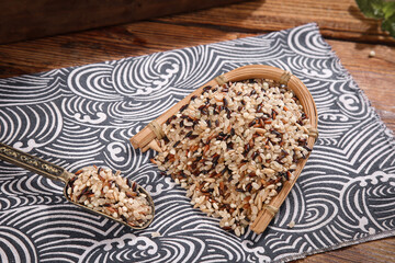 Organic Mixed Grains and Brown Rice in Bamboo Basket on Wooden Table
