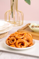 Spicy Squid Rings on White Plate - Delicious Seafood Appetizer Ready to Eat