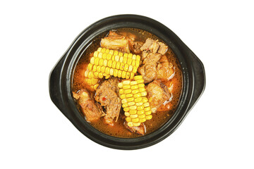 Pork Ribs and Corn Soup in Black Pot on White Background - Traditional Comfort Food