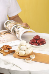 Artisanal Cheese Board with Dates and Nuts on Marble Table - Gourmet Food Styling