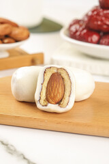 Handmade Marzipan Almond Confection on Wooden Board with Gourmet Cheese and Dates Platter