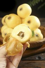Fresh White Jade Loquat Fruit from Suzhou China Being Peeled Showing Sweet Flesh and Seed