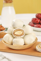 Handmade Steamed Buns with Sweet Filling and Red Dates on Light Background