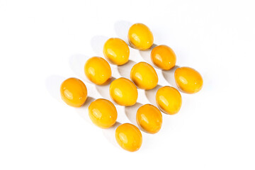 Fototapeta premium Marinated Golden Eggs with Sauce - Country Style Culinary Ingredient on White Background
