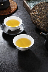 Traditional Puerh Tea Ceremony with Compressed Tea Cake and Ceramic Cups