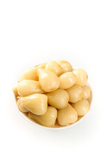 Pickled Rakkyo Japanese Onions in White Bowl on Clean Background