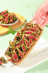 Weihai Dried Figs with Green Peeled Skin and Red Interior in Wooden Basket - Shandong Fruit Preserves