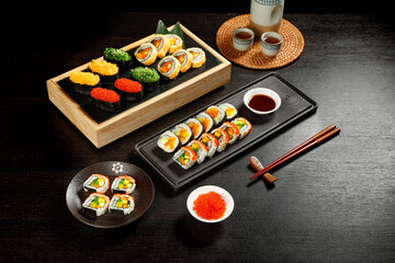 Traditional Japanese Sushi Platter Set with Assorted Rolls Nigiri Caviar Chopsticks and Tea Service